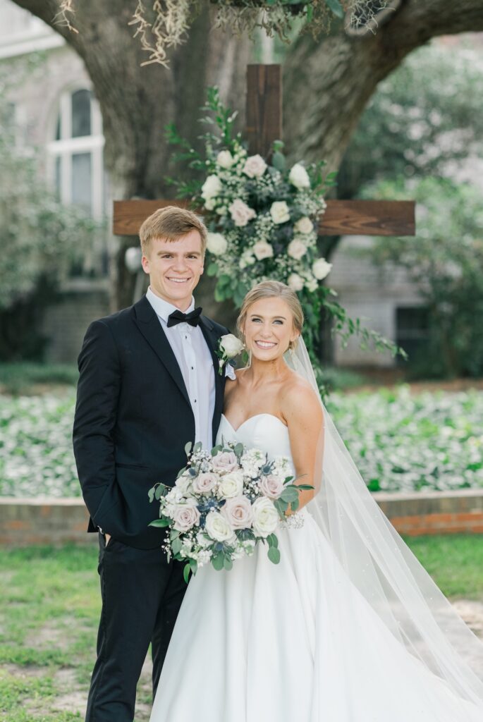 bride and groom in a typical portrait smiling at the camera