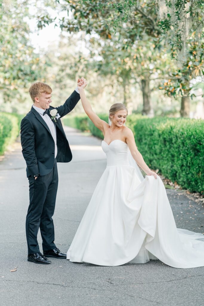 bride and groom portrait of the bride twirling with the groom