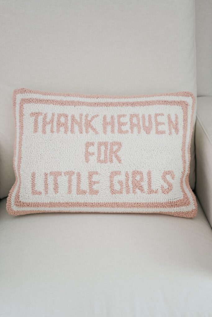 pillow in white and pink that reads thank heaven for little girls 